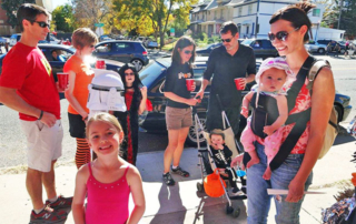 Group of Adults and Children in Costumes at Boo n' Brew